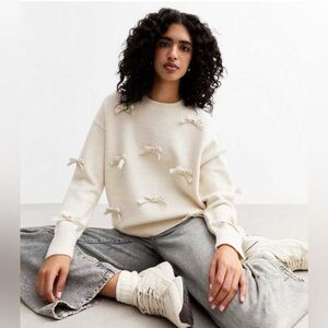 Gilli Cream Sweater with Bow Accents